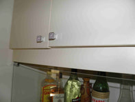 Cupboard door hinge adjustment
